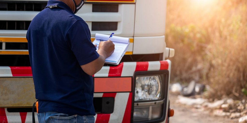 Trucker signing a legal form