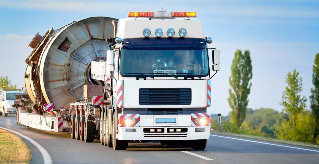 Truck driving on the road with abnormal load