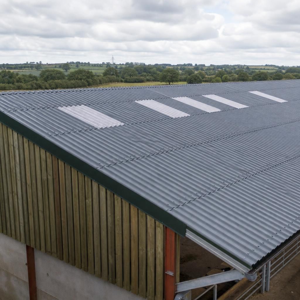 Steel roofing sheets fitted to the roof of an existing agricultural building